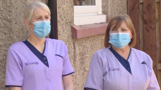 Care workers wearing masks