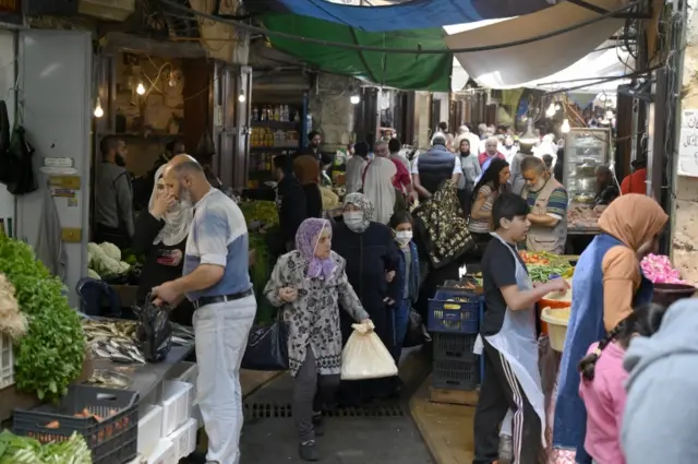 People shop at a market in Tripoli, Lebanon, on 3 May 2020