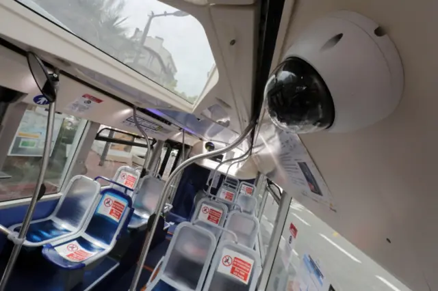 A surveillance camera on a bus