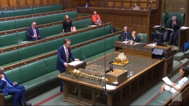 Health Secretary Matt Hancock standing and answering questions on the COVID-19 pandemic