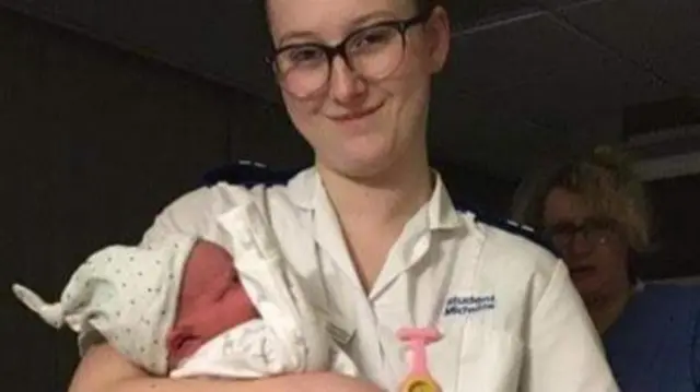 A student with a baby