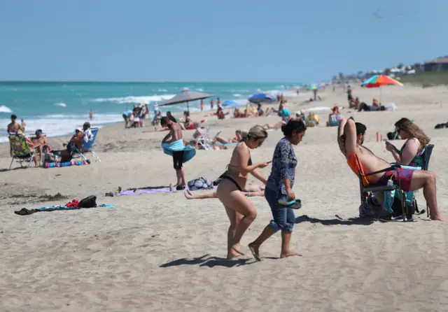 Beachgoers enjoy the weather on May 04, 2020 in Jensen Beach, Florida