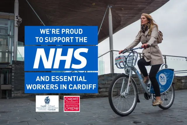 Woman on nextbike with NHS slogan next to it