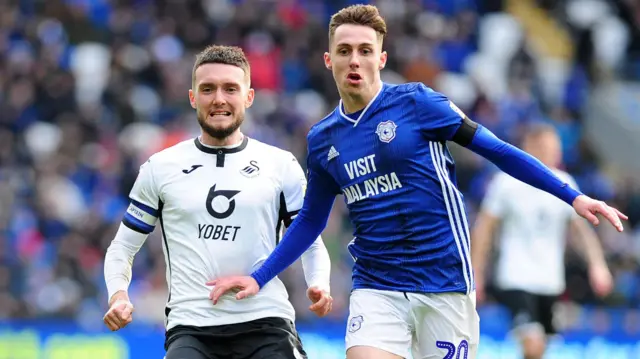 Swansea City's Matt Grimes and Cardiff City's Gavin Whyte