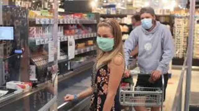 supermarket shoppers with masks