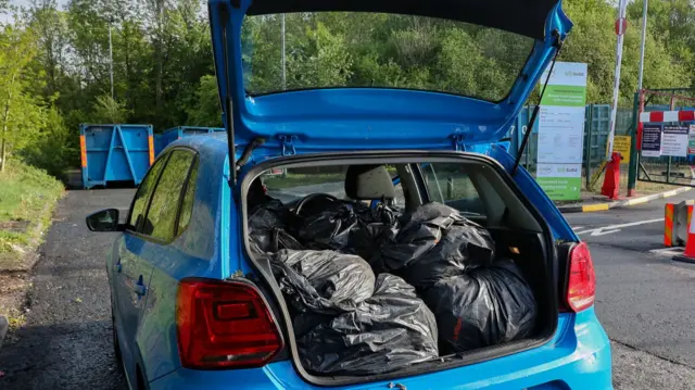 Car with recycling waste