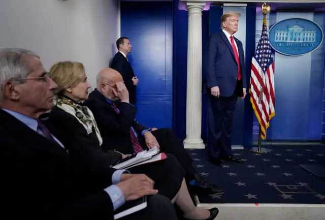 President Donald Trump and members of the task force