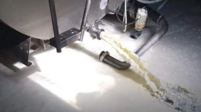 Milk being dumped at a farm in Cardigan