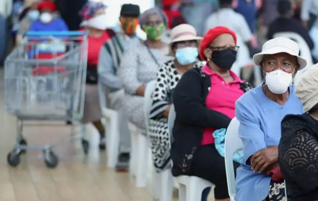 Customers sit on chairs at Maponya Mall as South Africa starts to relax some aspects of a stringent nationwide lockdown