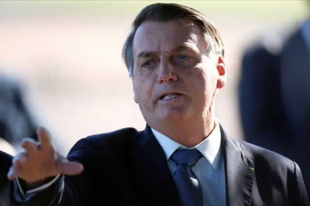 Brazilian President Jair Bolsonaro gestures as he leaves Alvorada Palace, in Brasilia, Brazil May 5, 2020.