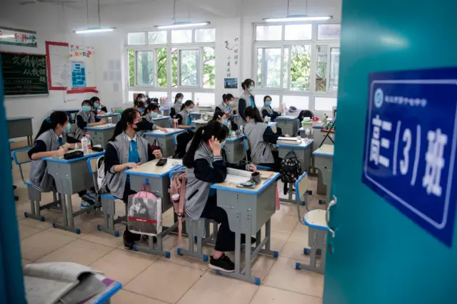 Senior students attend class at a high school in Wuhan in China's central Hubei province on May 6, 2020.