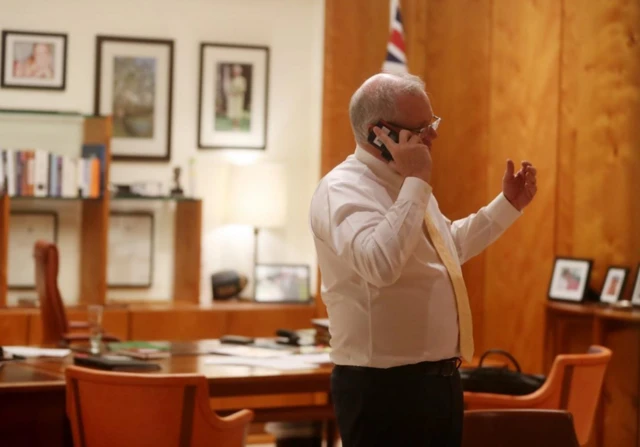 Scott Morrison talking to the Queen in his office