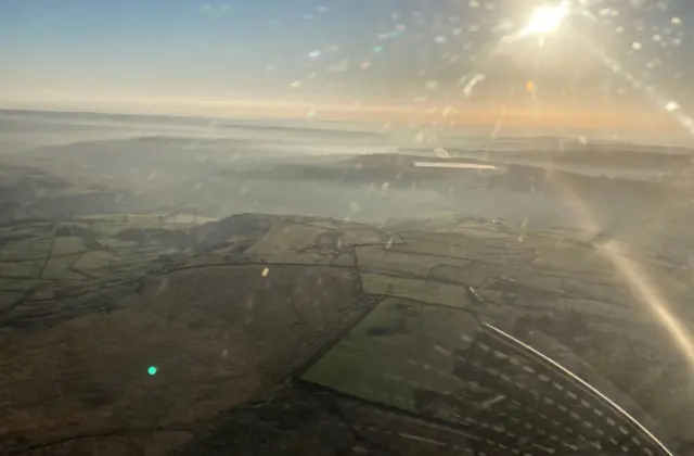 Aerial view of sun and fields