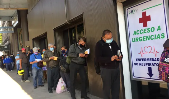 People line up while waiting to be treated at a private hospital in Mexico City, Mexico, 05 May 2020.