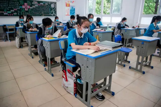 Senior students attend class at a high school in Wuhan in China's central Hubei province on May 6, 2020