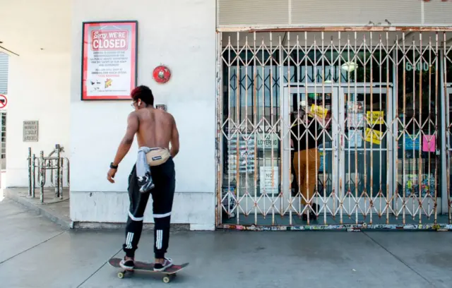 A skater outside the closed Amoeba Music store, a Hollywood landmark