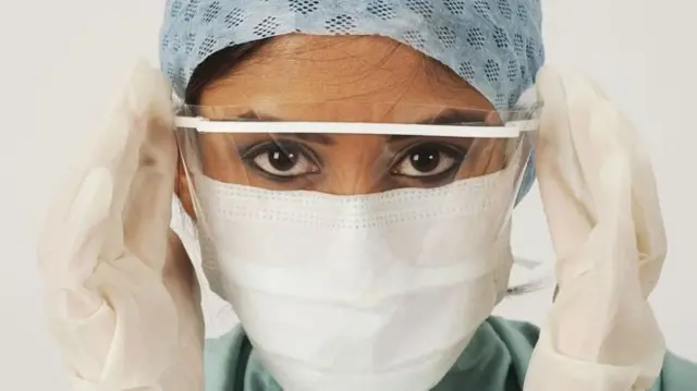 NHS worker wearing PPE