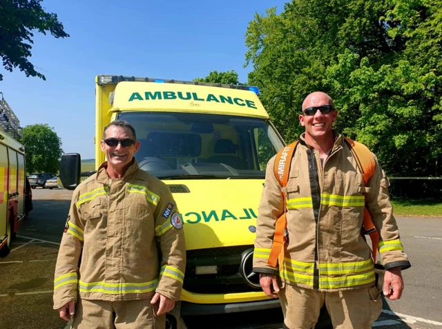 Firefighters with ambulance