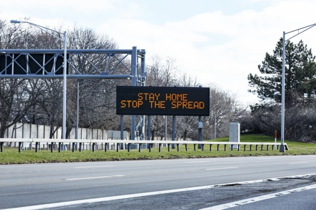 Stay home road sign