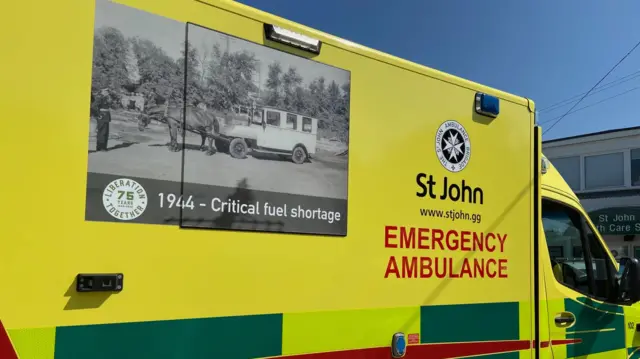 Ambulance with a picture of a WWII ambulance on side.