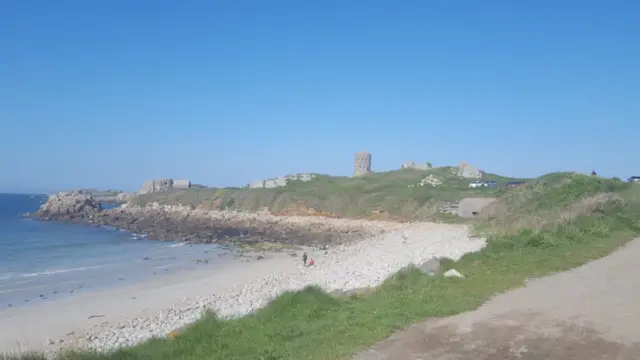 L'Ancress Beach and loophole tower