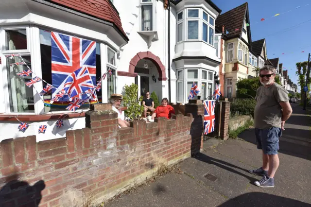 People enjoy a social distancing VE Day street party