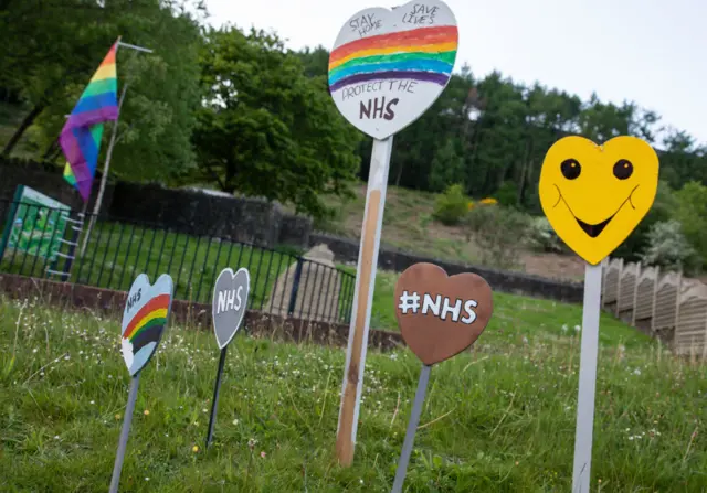 Children of Wattsville have painted  signs to show thanks for the work of the NHS