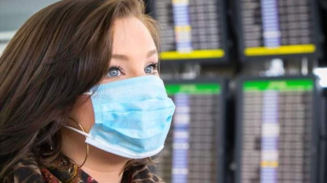 woman wearing mask in airport