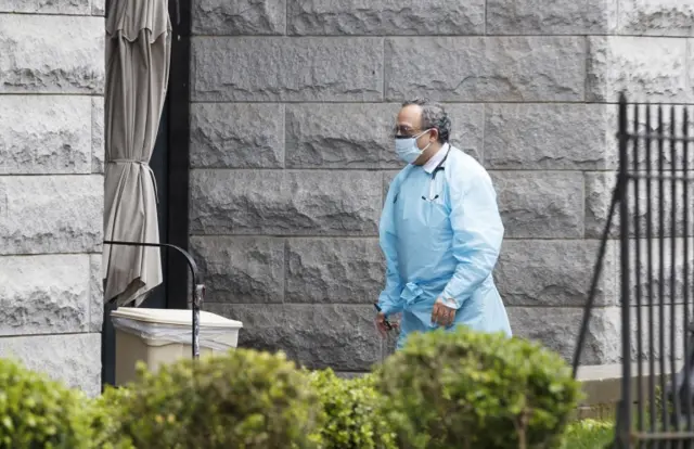 A man walks into the Cobble Hill Health Center, a nursing home and rehabilitation center in Brooklyn, New York,