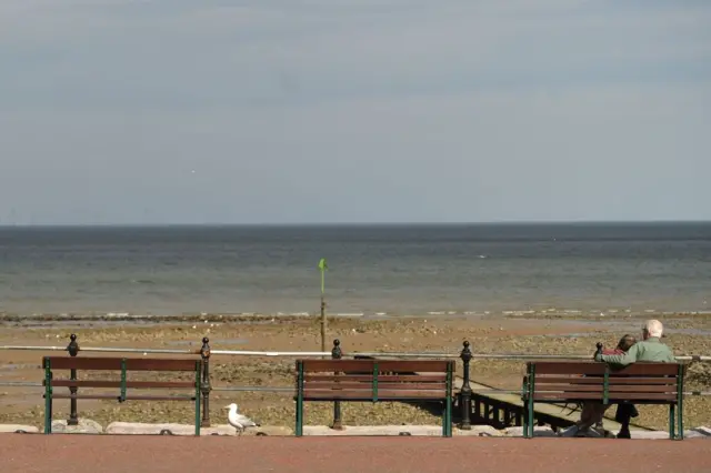 A couple on a bench in Llandudno