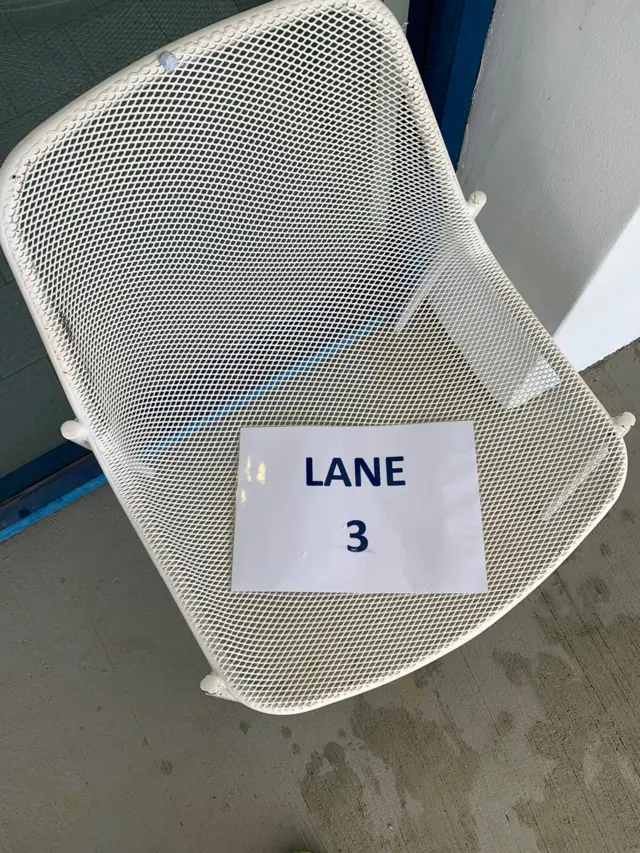 A chair with sign saying "LANE 3"