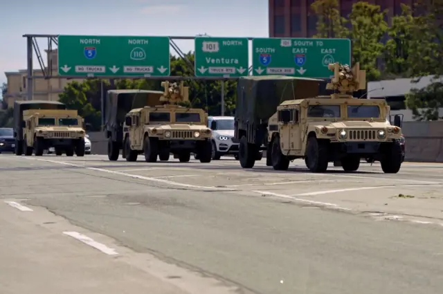 California National Guard armed vehicles are seen on the freeway as they patrol after demonstrators protested the death of George Floyd in Los Angeles, California