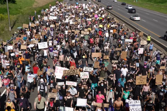 Protesters march in St Paul, Minneapolis