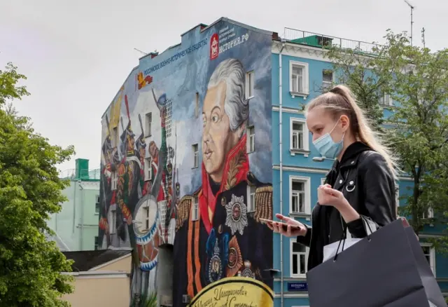 A woman wears a face mask in Moscow