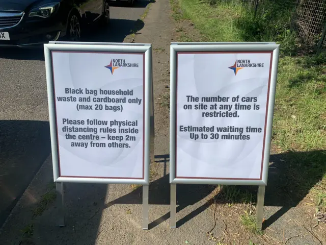 Signs outside recycling point in North Lanarkshire