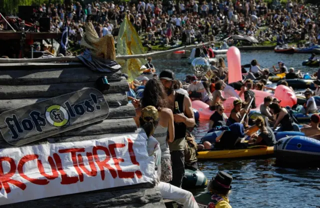 People gathered on a canal in Berlin