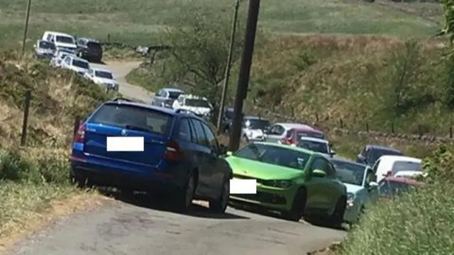 Cars parked around Knotbury