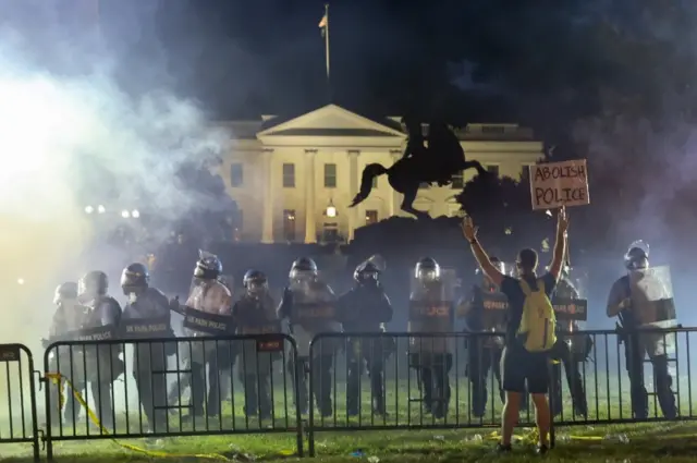 Police and protesters in Lafayette Park near the White House in Washington, DC, on 31 May 2020