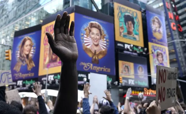 Protesters chant "I can't breathe" - the dying words of George Floyd as well as New Yorker Eric Garner who died in 2014 after police placed him in a chokehold