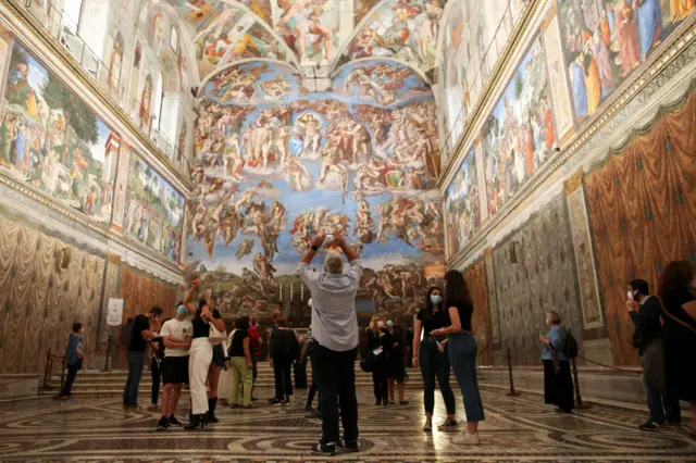 Vistors view the Sistine Chapel frescoes at the Vatican Museums on 1 June, 2020 in Vatican City, Vatican