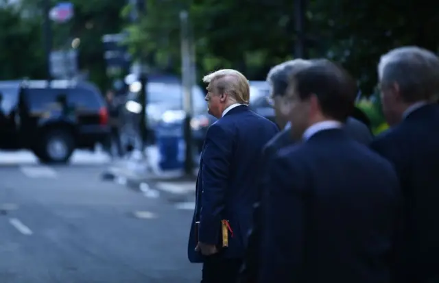 Trump crosses the street