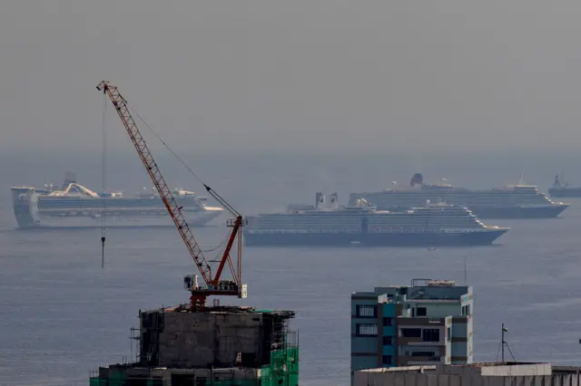 Cruise ships sit idle in the waters of Manila Bay as their crew completes quarantine before being allowed to disembark, on May 29, 2020 in Manila, Philippines.