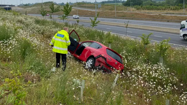 Car crashed into an embankment on the A14 westbound at junction 19 on the Catthorpe Interchange, in Leicestershire