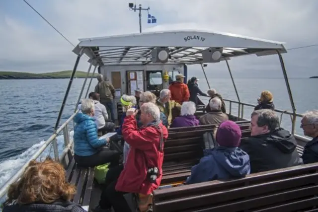 Tourists on a boat in Shetland