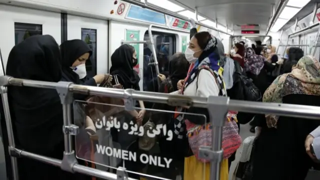 Iranian women stand inside the women-only section of a train on Tehran's metro (10 June 2020)