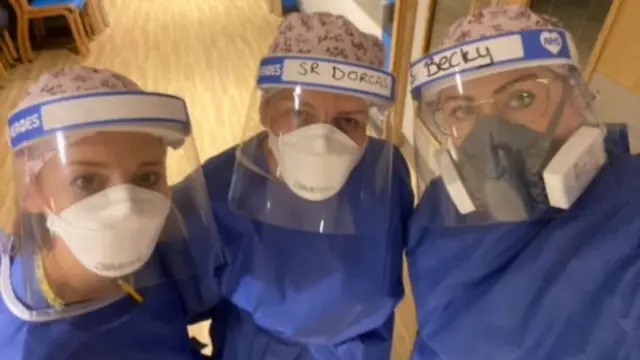 Three nurses in PPE