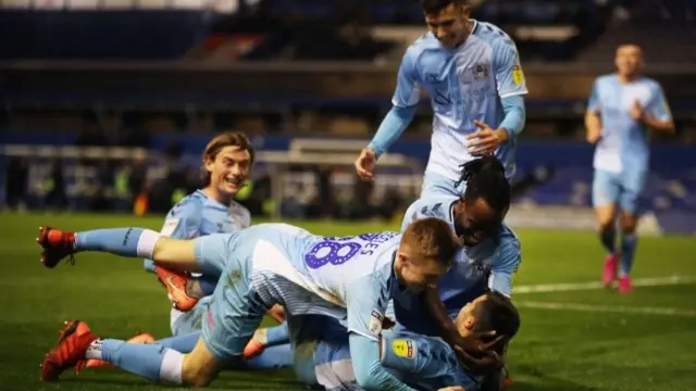 Coventry City"s Liam Walsh celebrates with teammates in November during a game