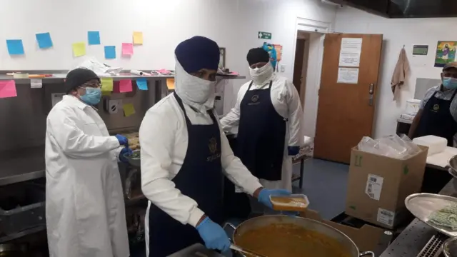 Volunteers making food