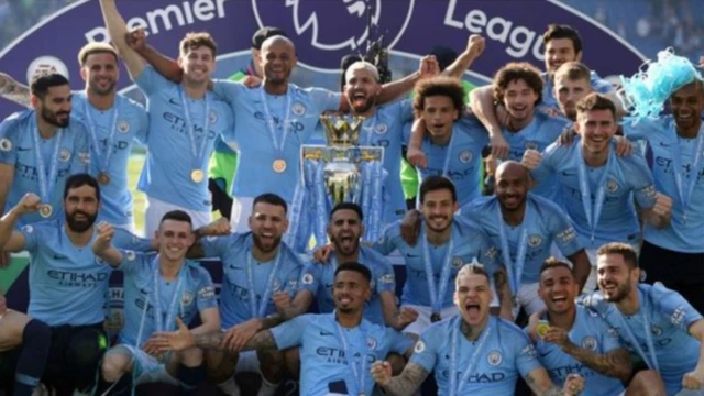 Manchester City celebrate after being presented with the Premier League trophy for 2018-19
