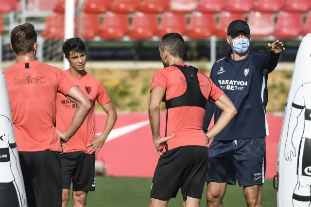 Sevilla coach Julen Lopetegui wears a face mask as he oversees a training session during the lockdown